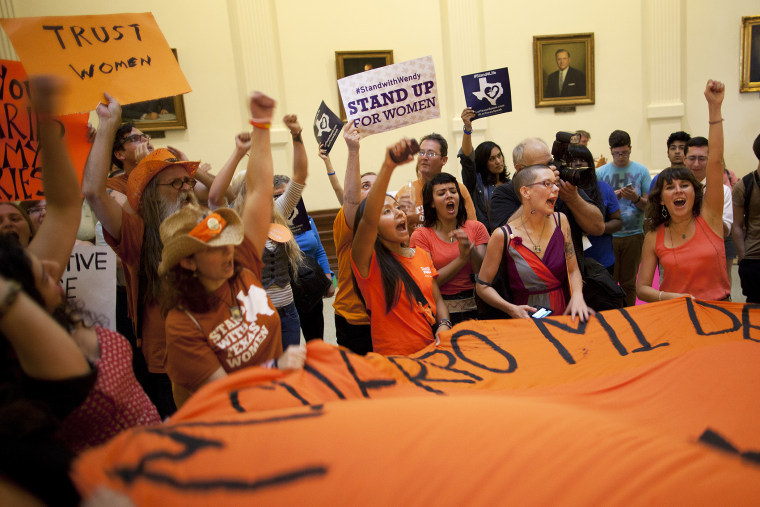Abortion rights supporters rally on the floor of the State Capitol's rotunda in Austin, Texas, July 12, 2013.