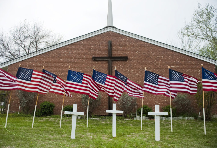U.S. flags and crosses representing victims of the shooting at Fort Hood military base are displayed outside Central Christian Church in Killeen, Texas, April 3, 2014.