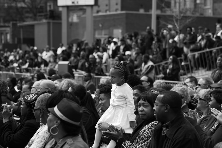 A little girl listens in the crowd at the reopening of the National Civil Rights Museum, April 5, 2014, in Memphis, Tenn.