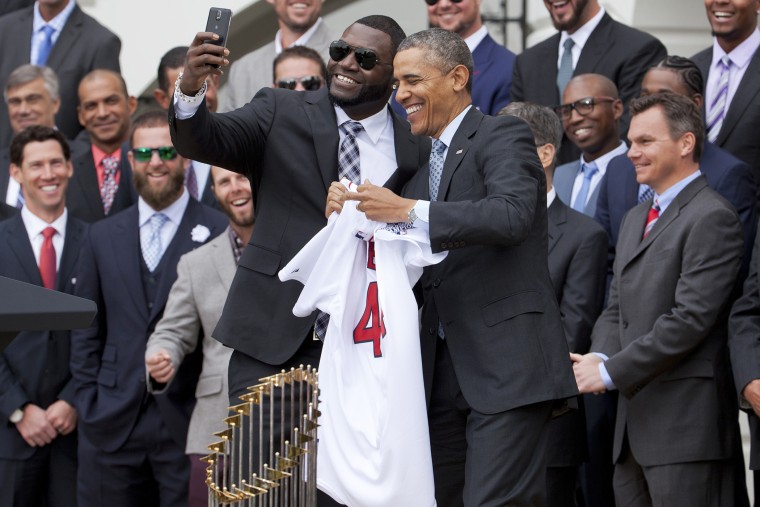 Boston Red Sox player David Ortiz, left, takes a selfie with President Barack Obama, April 1, 2014 on the South Lawn of the White House in Washington, where the president honored the Boston Red Sox on their 2013 World Series championship.