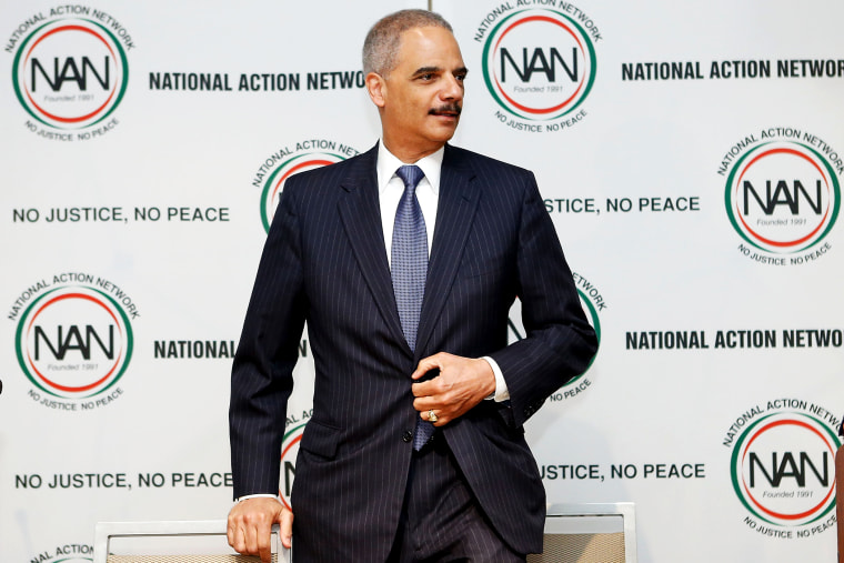 U.S. Attorney General Eric Holder takes a seat at the 16th Annual National Action Network's Convention in New York, April 9, 2014.