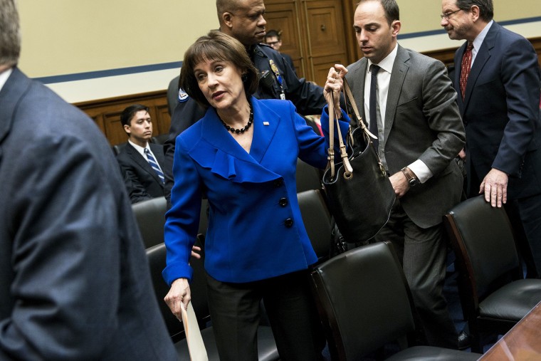 Lois Lerner leaves following a hearing of the House Oversight and Government Reform Committee, March 5, 2014.