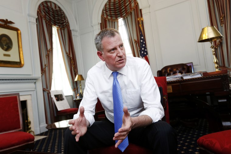 New York Mayor Bill de Blasio gives an interview at City Hall in New York, April 9, 2014.