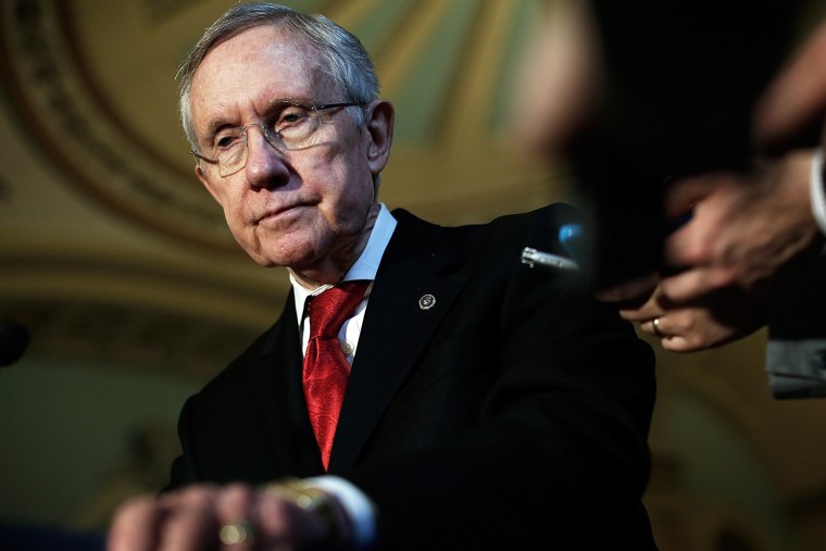 Harry Reid (D-NV) speaks with reporters following the weekly policy luncheon for Senate Democrats April 8, 2014.