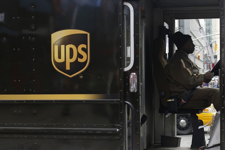 A UPS delivery truck makes its way through Times Square in New York on March 5, 2014.