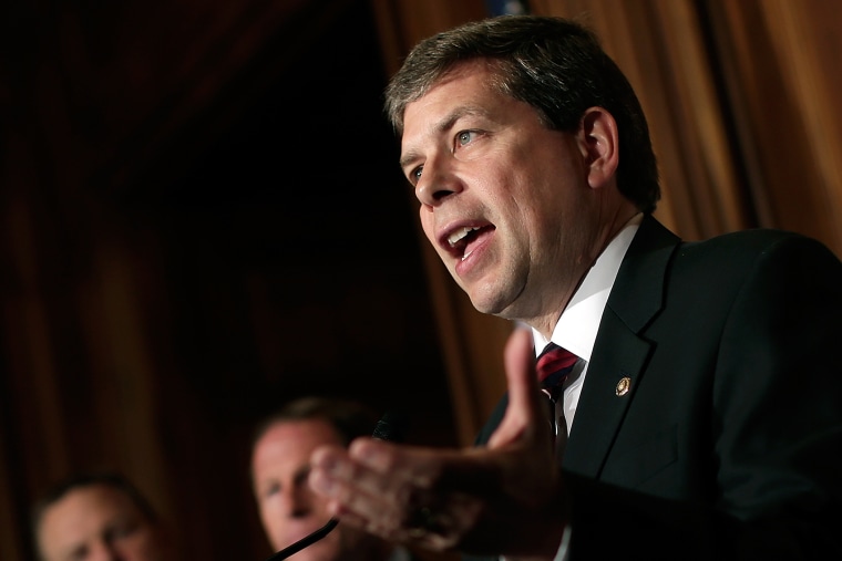 U.S. Sen. Mark Begich (D-AK) (R) speaks at a press conference at the U.S. Capitol on Oct. 9, 2013 in Washington, DC.