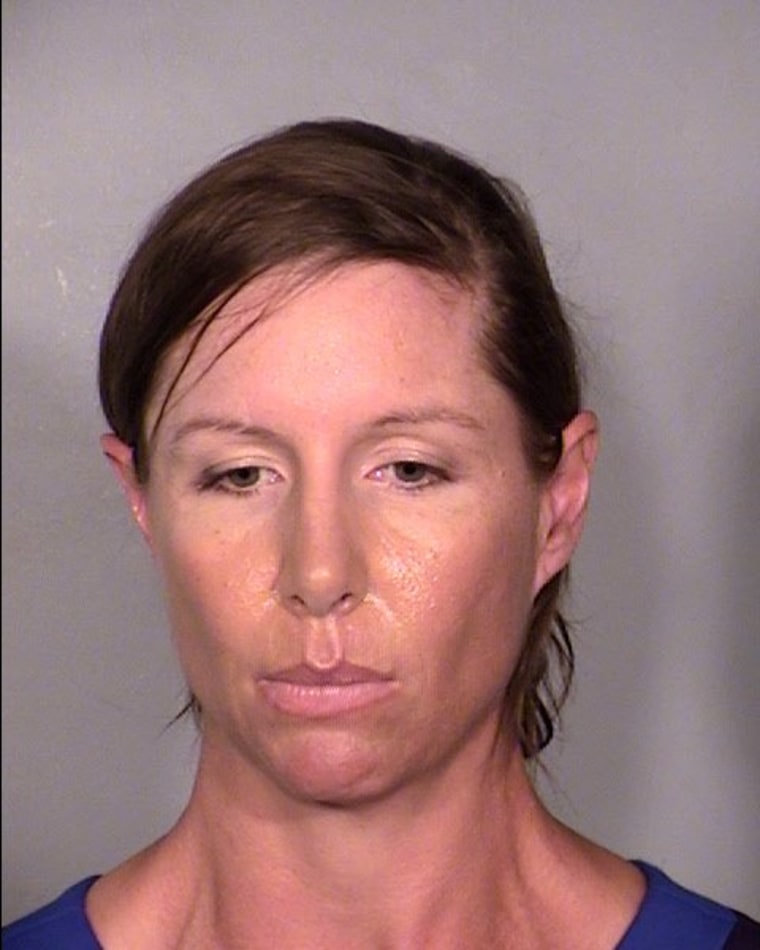 Alison Ernst poses for her mugshot after being arrested for disorderly conduct in Las Vegas, Nevada, April 10, 2014.