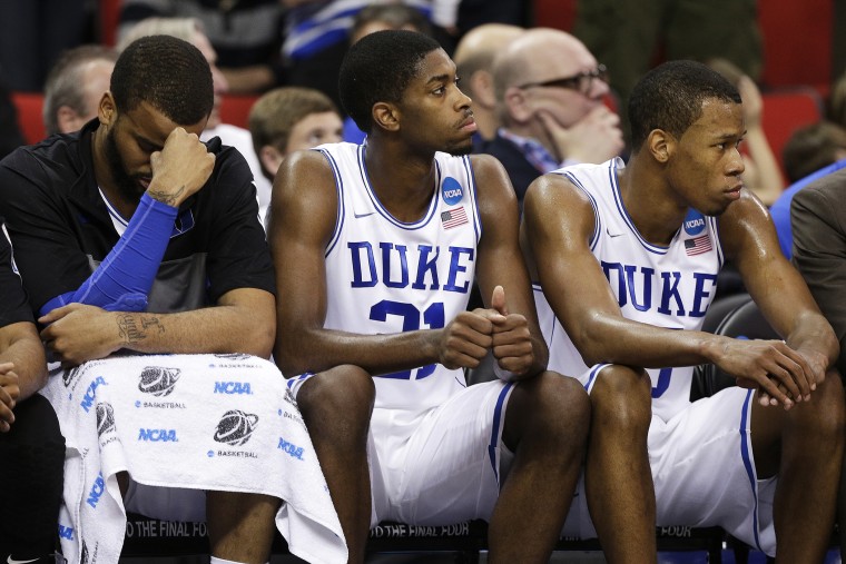 Duke's Josh Hairston, Amile Jefferson and Rodney Hood sit on the bench during the second half of an NCAA college basketball second-round game, March 21, 2014.