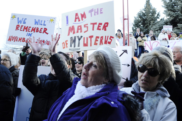 Abortion-rights advocates demonstrate during a rally outside a civic center in Fargo, N.D.