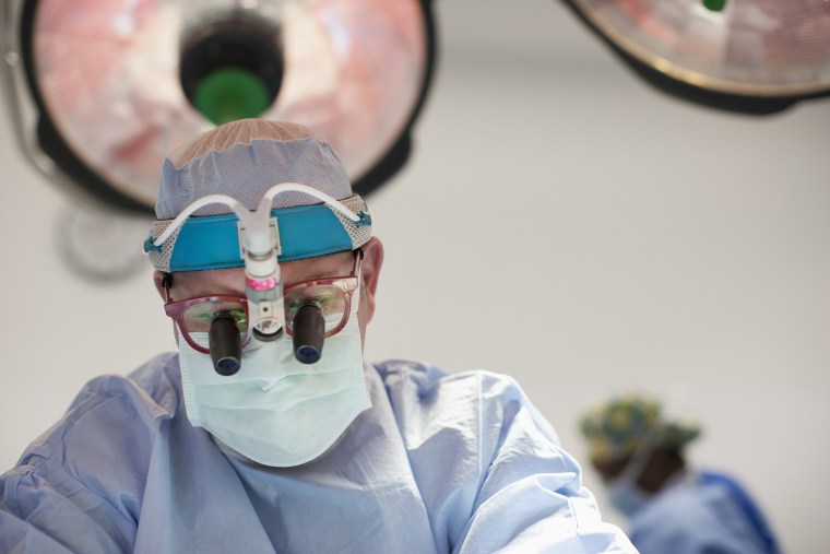 A surgeon in the operating room.