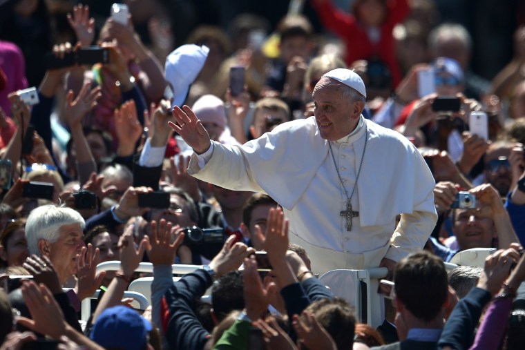 Pope Francis greets the crowd after the Easter mass on April 20, 2014 at St Peter's square in Vatican.