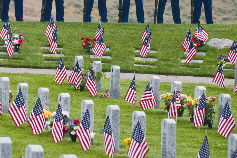 Marines stand at ease on the hillside during a Memorial Day Ceremony on Monday, May 31, 2010 at the Idaho Veterans Cemetery in Boise, Idaho.