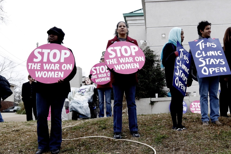 Abortion rights supporters stand outside the Jackson Women's Health Organization Inc., in Jackson, Miss., on Jan. 22, 2013.