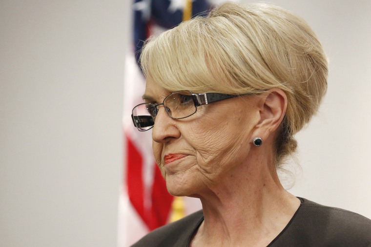 Arizona Republican Gov. Jan Brewer pauses during a news conference, Feb. 26, 2014, in Phoenix, Ariz.