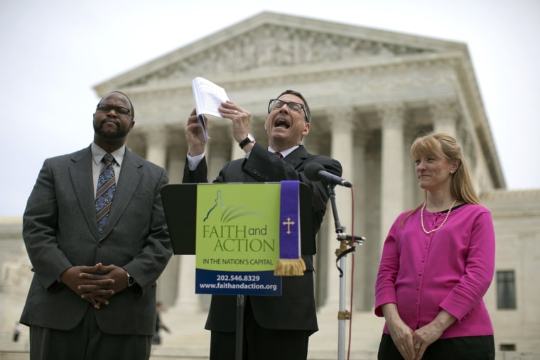 Reverend Dr. Rob Schenck, of Faith and Action, center, speaks in front of the Supreme Court with Raymond Moore, left, and Patty Bills, both also of Faith and Action, during a news conference, Monday, May 5, 2014, in Washington.