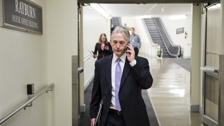 Rep. Trey Gowdy, R-S.C., chair of the newly formed select committee to investigate the State Department's handling of the 2012 attack in Benghazi, speaks on his phone as he walks to the Rayburn House Office Building, May 7, 2014.
