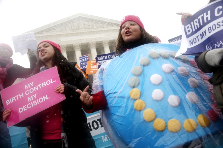 Margot Riphagen of New Orleans, La., wears a birth control pills costume as she protests in front of the Supreme Court in Washington, on March 25, 2014.