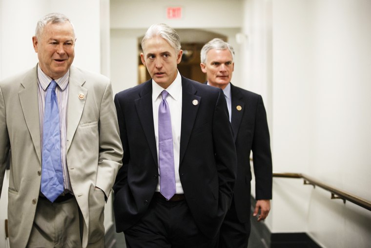 Rep. Trey Gowdy, R-S.C., center, walks to a House Republican Conference meeting at the Capitol, May 7, 2014.