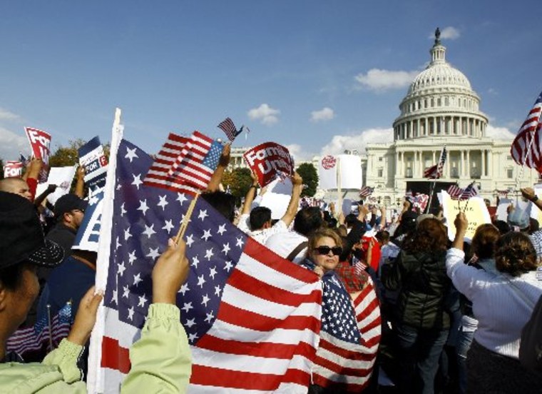 Demonstrators protest during an immigration reform rally in front of the U.S. Capitol on Capitol Hill in Washington in this October 13, 2009 file photo.