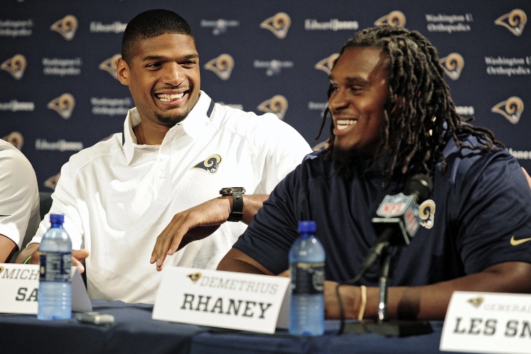 Michael Sam (left) jokes around with seventh round pick offensive lineman Demetrius Rhaney during a press conference at Rams Park on May 13, 2014 in St. Louis, Mo.