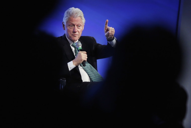 Former U.S. President Bill Clinton gestures during an onstage interview at the 2014 Peterson Foundation Fiscal Summit in Washington May 14, 2014.