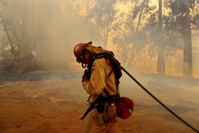 Firefighters battle wildfire in Fallbrook, California