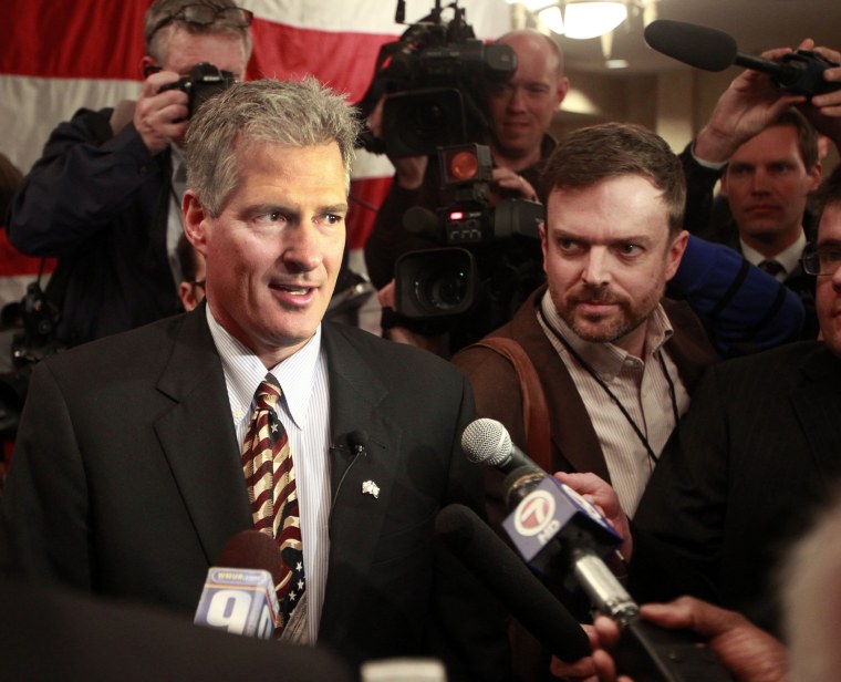 Former Massachusetts U.S. Senator Scott Brown walks into a crowd of supporters after announcing his plans to run for U.S. Senator in New Hampshire, April 10, 2014 in Portsmouth, N.H.