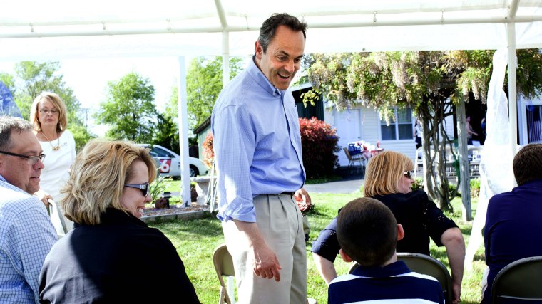 Senate candidate Matt Bevin, center, chats with seven-year-old Cutter Singleton of Marion, Ky., on May 4, 2014, during a supporter picnic in Paducah, Ky.