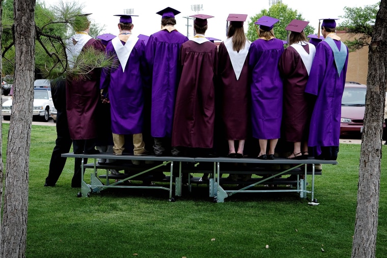 High school students at graduation.