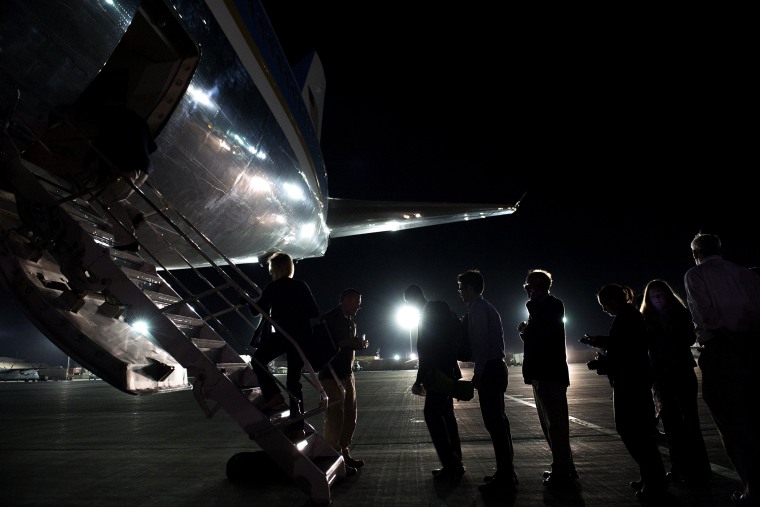 Members of the press and staff board Air Force One at Bagram Air Field, north of Kabul, in Afghanistan, May 26, 2014.