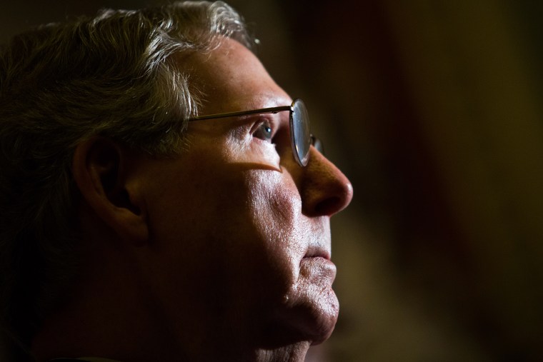 Senate Minority Leader Mitch McConnell (R-Ky.) looks on during a news conference on Capitol Hill, Nov. 21, 2013 in Washington, D.C.