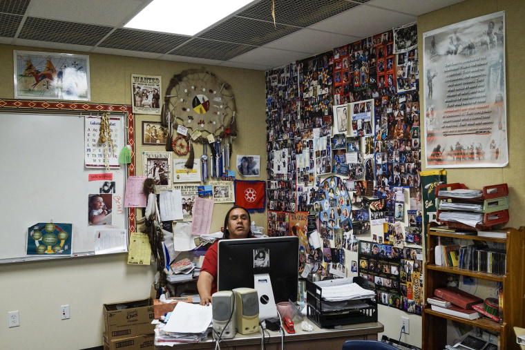 Lakota language teacher Roger White Eyes at the Red Cloud school in Pine Ridge. Founded in 1888, nearly 100 percent of students graduate and go on to post-secondary education. More students at Red Cloud have earned the prestigious Gates Millennium Scholarship than at any other school of its size in the country.