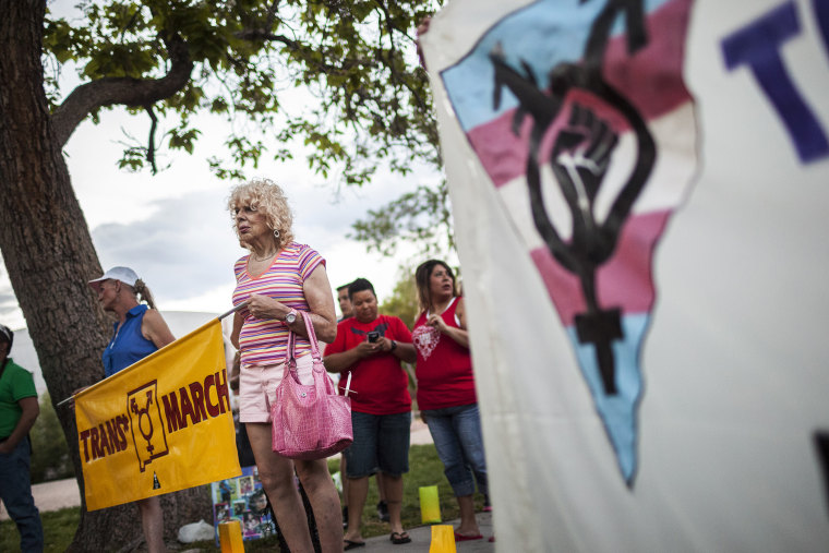 In this May 29, 2014 photo, Denee Mallon, second from left, takes part in the Trans March to Morningside Park in Albuquerque, N.M.