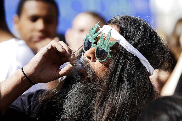 A man smokes a joint in Civic Center Park in Denver, Colorado.