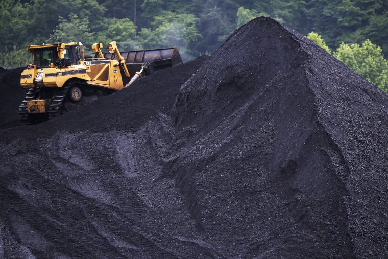 A bulldozer operates atop a coal mound at the CCI Energy Slones Branch Terminal June 3, 2014 in Shelbiana, Kentucky.