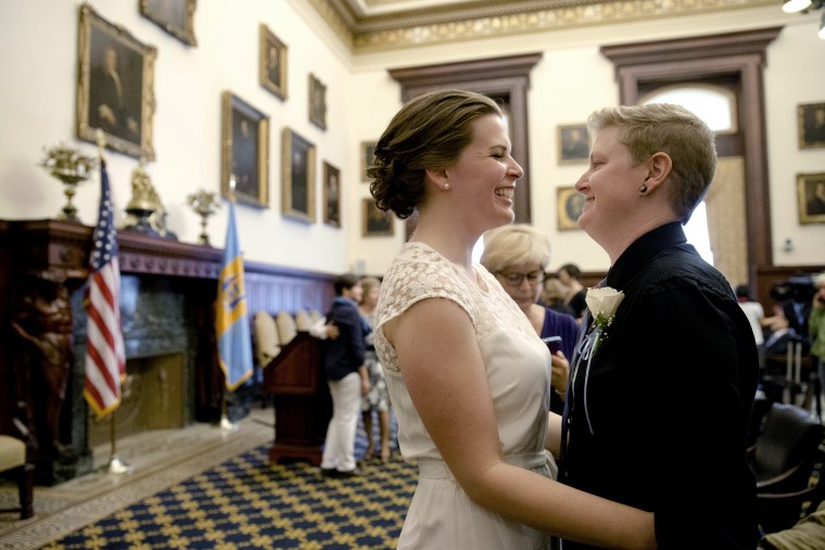 Corey Crawford, right, and Jessica Samph smile to each other before their wedding on May 23, 2014, at City Hall in Philadelphia.