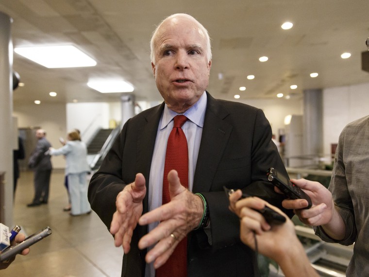 Sen. John McCain, R-Ariz., speaks to reporters at the Capitol in Washington, Wednesday, June 4, 2014.