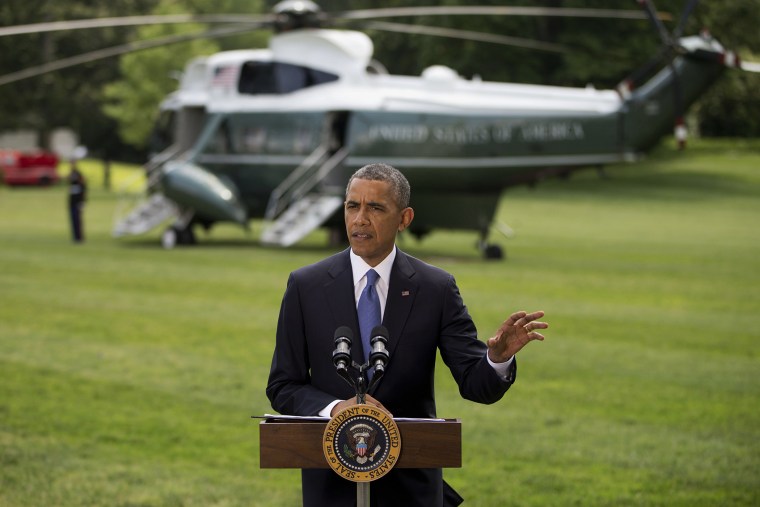President Barack Obama talks about his administration's response to a growing insurgency foothold in Iraq, Friday, June 13, 2014, on the South Lawn of the White House in Washington, prior to boarding the Marine One Helicopter for Andrews Air Force Base, M