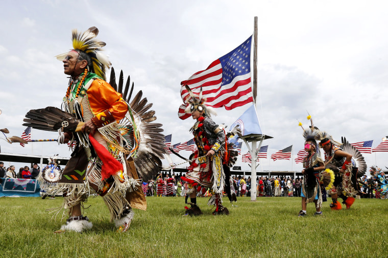 Native American dancers from more than 20 reservations in North and South Dakota perform before the arrival of President Barack Obama and first lady Michelle Obama on the Standing Rock Indian Reservation Friday, June 13, 2014, in Cannon Ball, N.D.