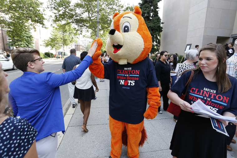 A Republican intern in a squirrel costume and a T-shirt that reads, \"Another Clinton in the White House is Nuts\"