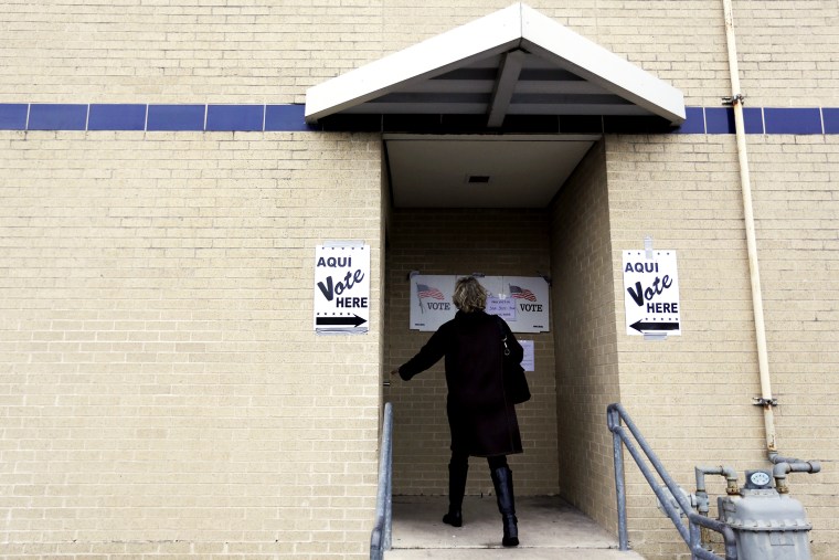 A voter arrives at a polling site, Tuesday, March 4, 2014, in San Antonio.