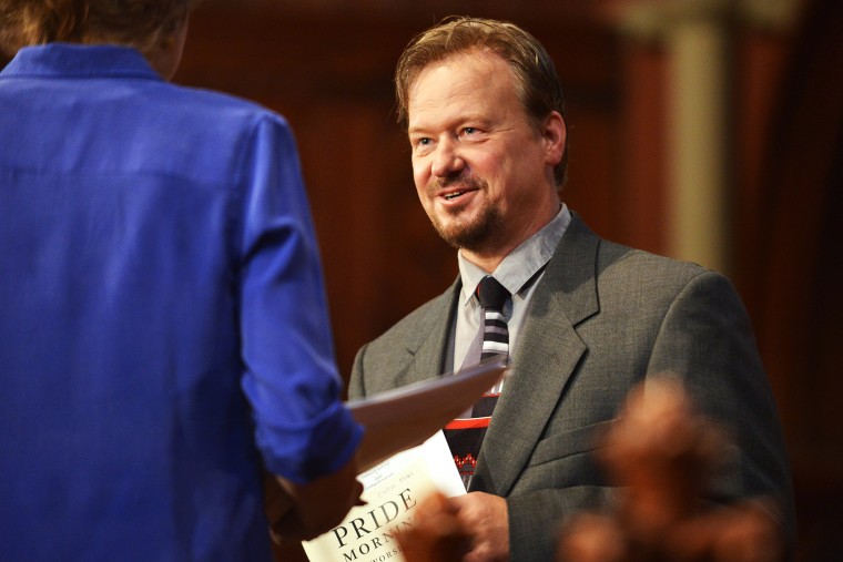 Frank Schaefer, right, speaks with Rev. Nancy Taylor, left, before a ceremony where Schaefer received an Open Door Award for his public advocacy, June 14, 2014.