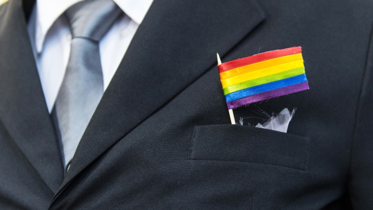 A man wears a rainbow flag in his pocket, December 8, 2013.