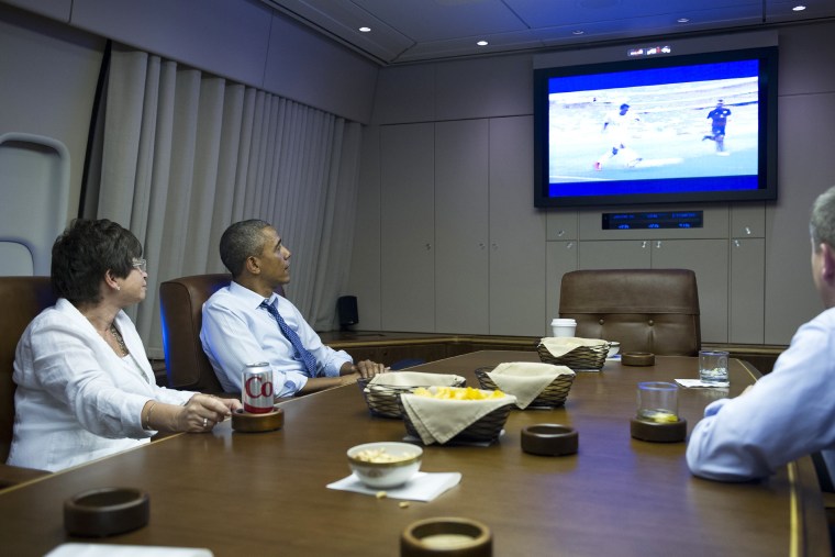 US President Barack Obama and Senior Advisor Valerie Jarrett (L) watch the 2014 World Cup match between the US and Germany while en route to Minnepolis, Minnesota on June 26, 2014.