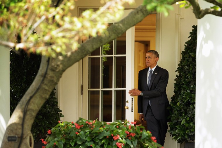 President Barack Obama steps out of the Oval Office as he departs the White House June 26, 2014 in Washington, DC.