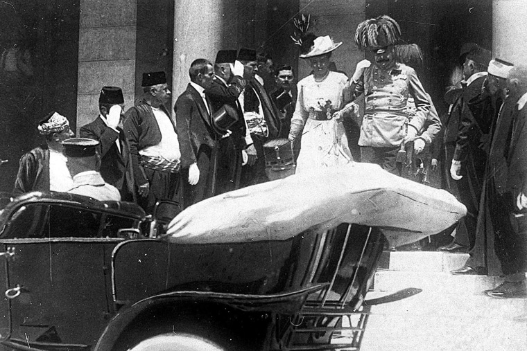 Archduke of Austria Franz Ferdinand walks to a car with his wife Sophie in Sarajevo on June 28, 1914, minutes before his assassination.
