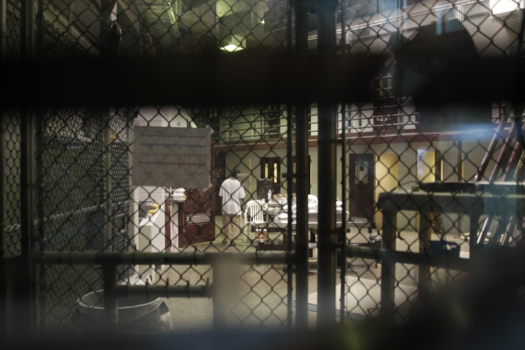 A prisoner walks through a communal pod inside an area of the Guantanamo Bay detention center known as Camp 6.