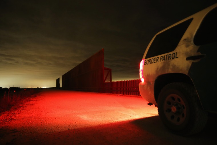 A U.S. Border Patrol vehicle stops near a section of the U.S.- Mexico border fence on April 10, 2013 in La Joya, Texas.