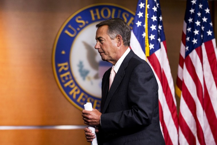 John Boehner leaves a news conference on Capitol Hill in Washington, Thursday, July 10, 2014.