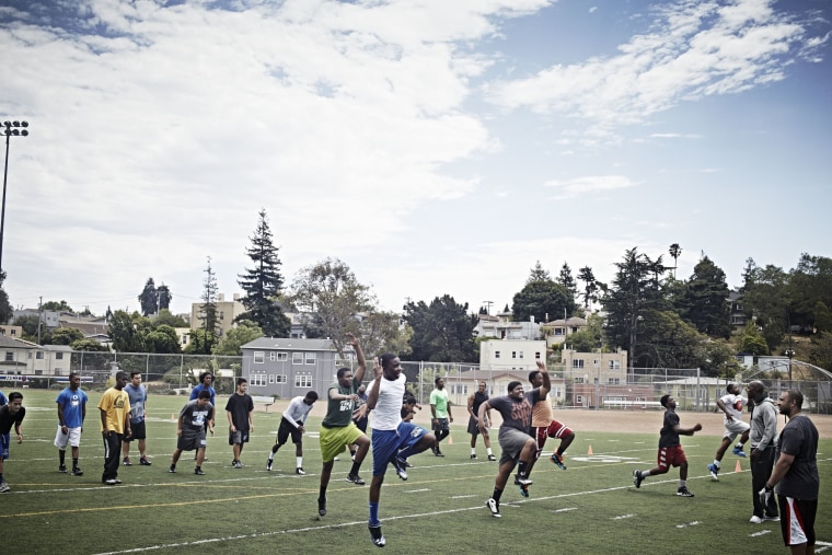 Willie Scott and his teammates at football practice at Oakland High School in Oakland, California, on July 7, 2014.